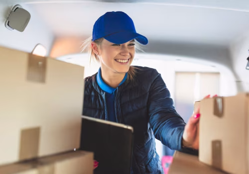 cheerful-woman-delivering-mail_23-2147767749