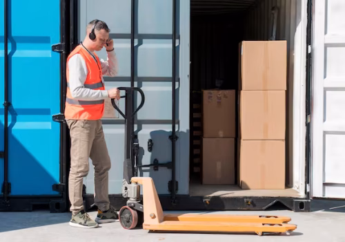 full-shot-man-with-pallet-truck_23-2148902570